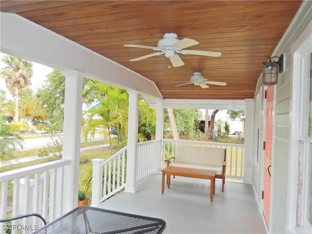 sunroom featuring ceiling fan