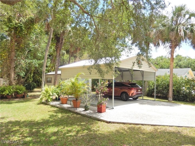 view of parking / parking lot with concrete driveway and a detached carport