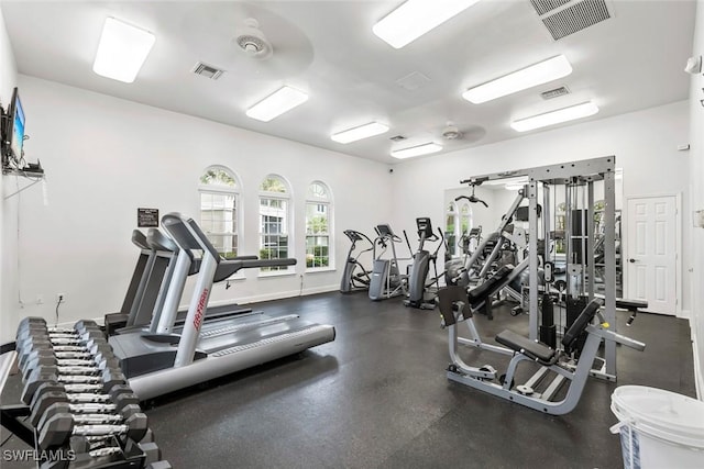 workout area featuring baseboards and visible vents