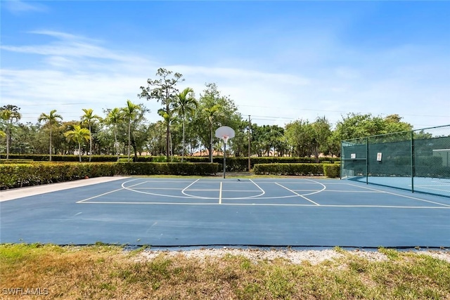 view of basketball court with fence and community basketball court