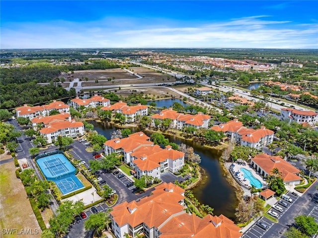 bird's eye view featuring a residential view and a water view