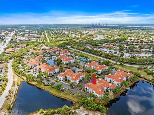 aerial view with a water view and a residential view