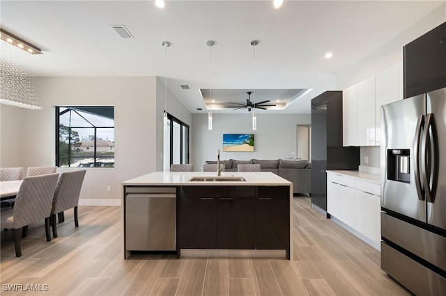 309 SW 15th Ter, Cape Coral, FL 33991 - kitchen with modern cabinets, a sink, and stainless steel appliances