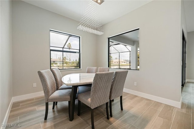 309 SW 15th Ter, Cape Coral, FL 33991 - dining area with baseboards and wood finish floors