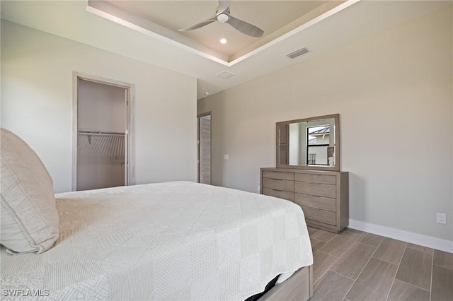 309 SW 15th Ter, Cape Coral, FL 33991 - bedroom featuring a tray ceiling, a ceiling fan, baseboards, visible vents, and recessed lighting