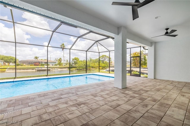 309 SW 15th Ter, Cape Coral, FL 33991 - outdoor pool with a patio, a water view, and a lanai