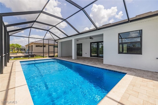 309 SW 15th Ter, Cape Coral, FL 33991 - outdoor pool with glass enclosure, a patio, and a ceiling fan
