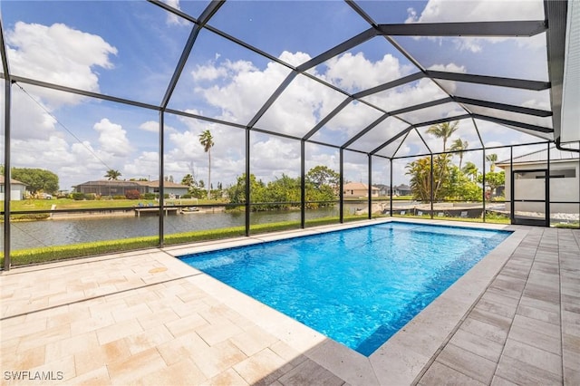 309 SW 15th Ter, Cape Coral, FL 33991 - outdoor pool with glass enclosure, a water view, and a patio area
