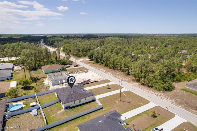 909-911 Homestead Rd S, Lehigh Acres, FL 33974 - drone / aerial view with a view of trees