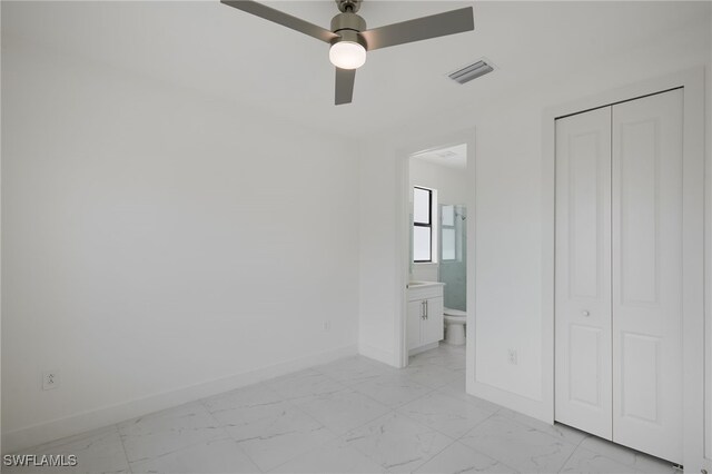 909-911 Homestead Rd S, Lehigh Acres, FL 33974 - unfurnished bedroom featuring a closet, visible vents, marble finish floor, and baseboards