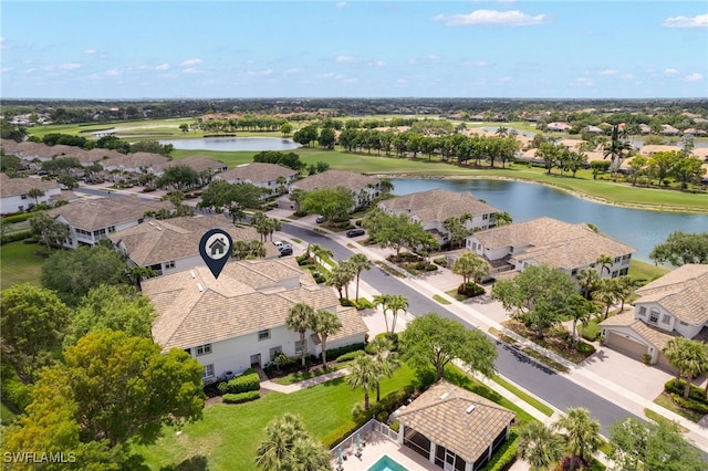 bird's eye view with a residential view, view of golf course, and a water view