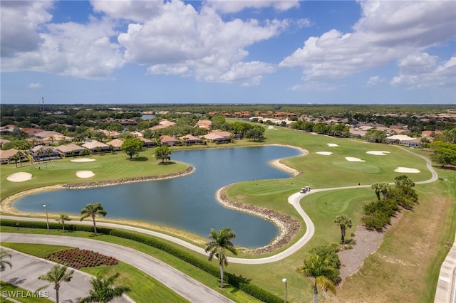 bird's eye view with a water view and view of golf course