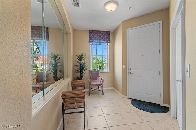 4834 Hampshire Ct Unit 207, Naples, FL 34112 - tiled entrance foyer featuring visible vents and baseboards