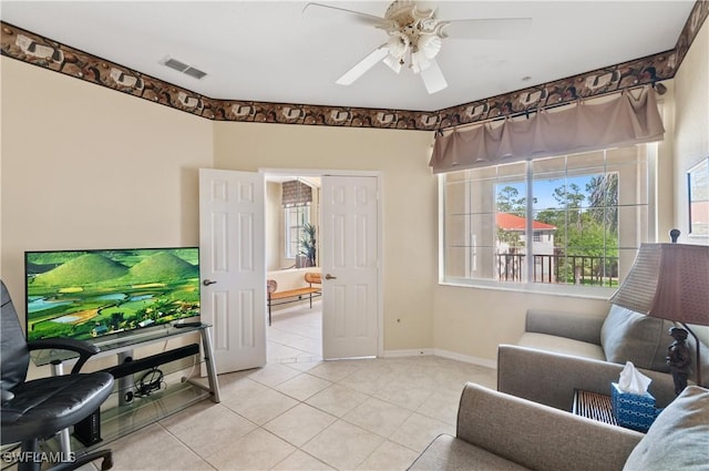 4834 Hampshire Ct Unit 207, Naples, FL 34112 - living area featuring light tile patterned floors, visible vents, baseboards, and a ceiling fan