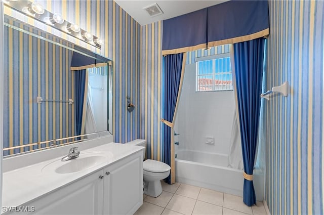 4834 Hampshire Ct Unit 207, Naples, FL 34112 - bathroom with tile patterned floors, vanity, wallpapered walls, and toilet