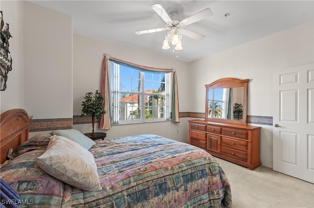 4834 Hampshire Ct Unit 207, Naples, FL 34112 - bedroom with light colored carpet and ceiling fan