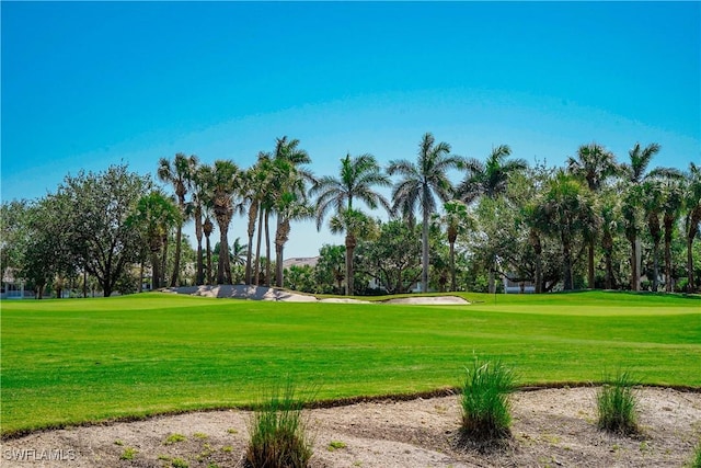 4834 Hampshire Ct Unit 207, Naples, FL 34112 - view of community featuring a yard and view of golf course