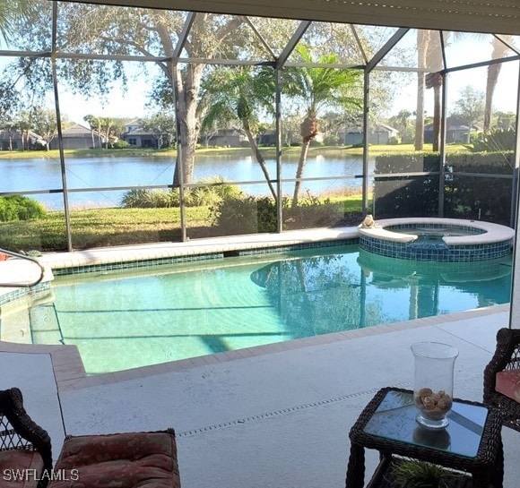 21809 Masters Cir, Estero, FL 33928 - view of pool with central AC, a water view, a lanai, and a pool with connected hot tub