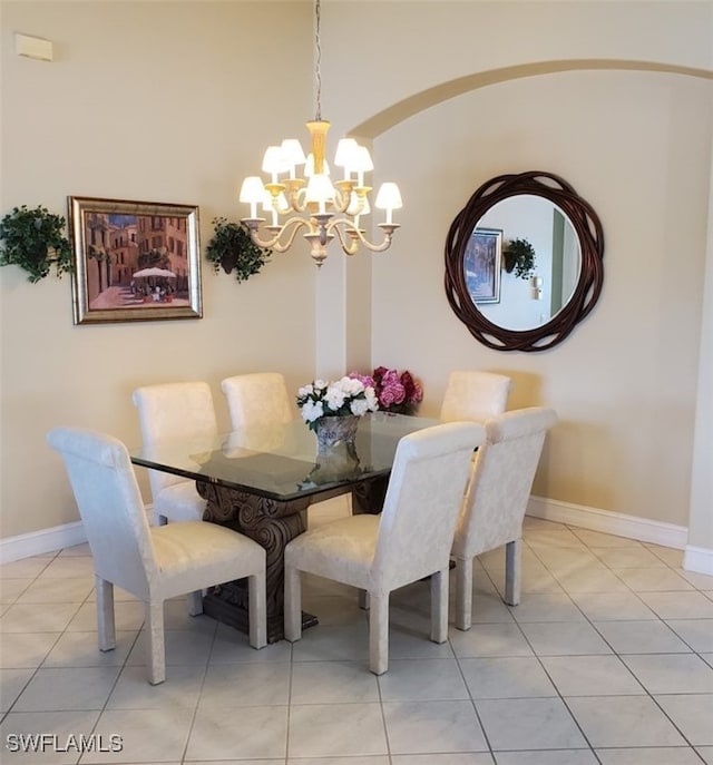 21809 Masters Cir, Estero, FL 33928 - dining area featuring baseboards, light tile patterned flooring, and a notable chandelier