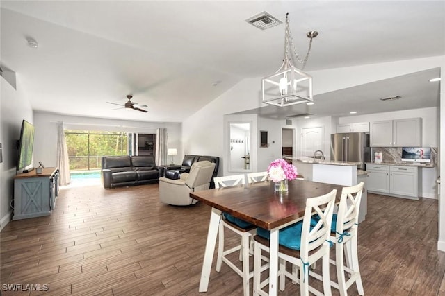 3009 35th St SW, Lehigh Acres, FL 33976 - dining space featuring visible vents, ceiling fan, lofted ceiling, and dark wood-style floors