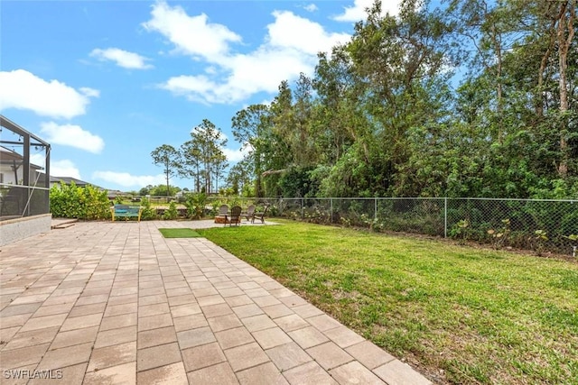 3009 35th St SW, Lehigh Acres, FL 33976 - view of yard featuring a fenced backyard, a lanai, and a patio area