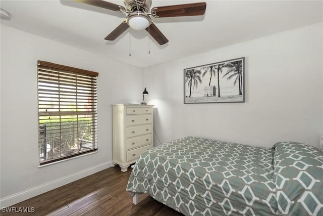 3009 35th St SW, Lehigh Acres, FL 33976 - bedroom with baseboards, a ceiling fan, and dark wood-type flooring