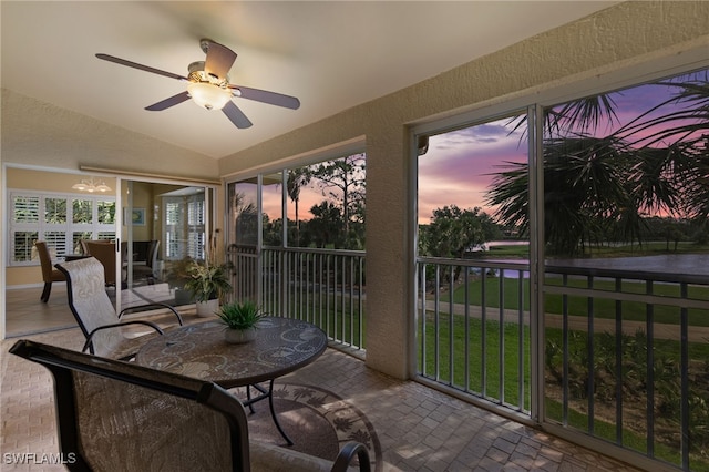 20231 Calice Ct Unit 2703, Estero, FL 33928 - sunroom / solarium with a textured wall, lofted ceiling, and brick patterned flooring