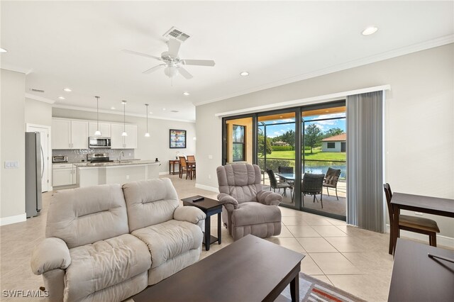 1408 Lucena Ln S, Naples, FL 34113 - living room with light tile patterned floors, visible vents, recessed lighting, a ceiling fan, and ornamental molding
