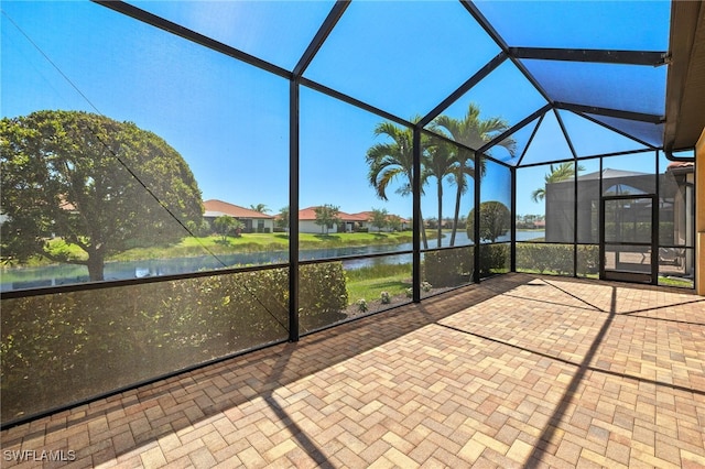 1408 Lucena Ln S, Naples, FL 34113 - unfurnished sunroom featuring a water view