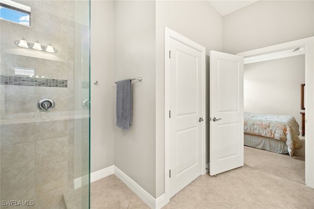 1408 Lucena Ln S, Naples, FL 34113 - bathroom featuring baseboards, tile patterned floors, ensuite bathroom, and tiled shower