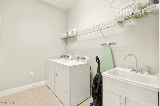 1408 Lucena Ln S, Naples, FL 34113 - laundry room featuring separate washer and dryer, baseboards, cabinet space, and a sink