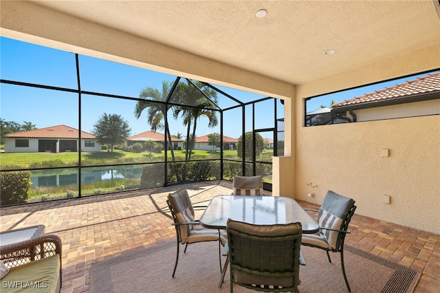 1408 Lucena Ln S, Naples, FL 34113 - view of patio featuring a residential view, a lanai, and a water view