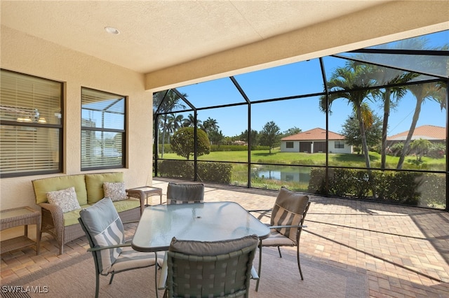 1408 Lucena Ln S, Naples, FL 34113 - view of patio with glass enclosure and a water view