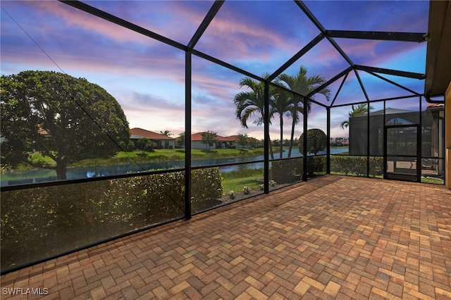 1408 Lucena Ln S, Naples, FL 34113 - unfurnished sunroom with a water view