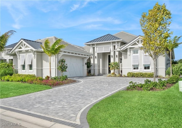 3359 Fanny Bay Ln N, Naples, FL 34114 - view of front of house with stucco siding, a garage, decorative driveway, and a front lawn