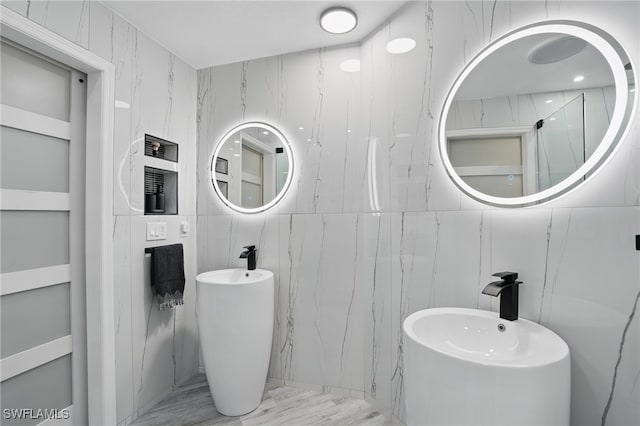 1220 Sarah Jean Cir Unit L103, Naples, FL 34110 - bathroom featuring tile walls and a sink