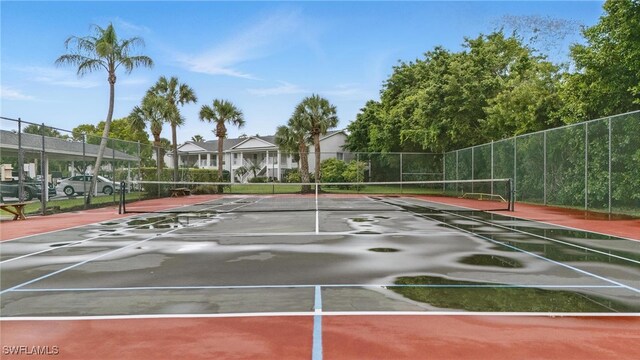 1220 Sarah Jean Cir Unit L103, Naples, FL 34110 - view of tennis court with fence