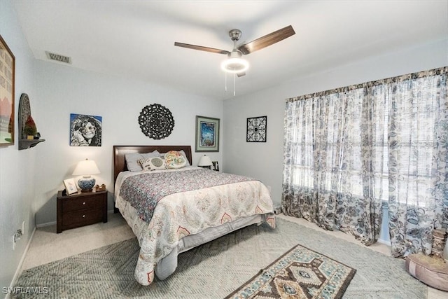 bedroom featuring visible vents, ceiling fan, baseboards, and carpet floors