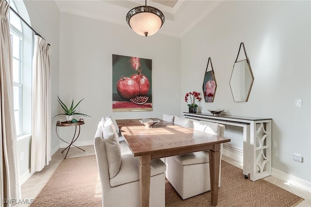 7699 Cottesmore Dr, Naples, FL 34113 - dining area featuring a healthy amount of sunlight, baseboards, and ornamental molding