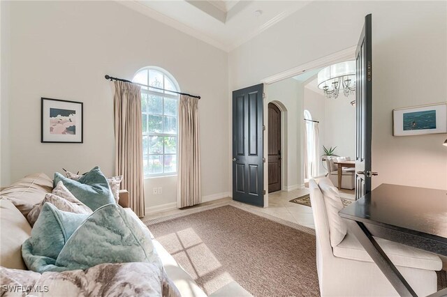7699 Cottesmore Dr, Naples, FL 34113 - bedroom featuring arched walkways, multiple windows, ornamental molding, and a notable chandelier