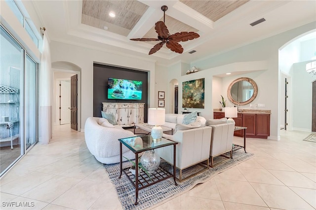 7699 Cottesmore Dr, Naples, FL 34113 - living area featuring arched walkways, ornamental molding, and coffered ceiling