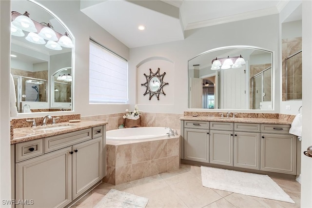 7699 Cottesmore Dr, Naples, FL 34113 - bathroom featuring a garden tub, crown molding, two vanities, a sink, and a stall shower