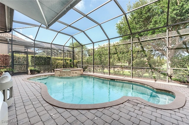 7699 Cottesmore Dr, Naples, FL 34113 - view of pool with glass enclosure, a patio area, and a pool with connected hot tub