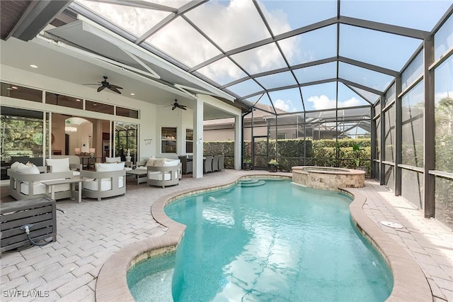 7699 Cottesmore Dr, Naples, FL 34113 - view of pool featuring ceiling fan, outdoor lounge area, a patio, glass enclosure, and a pool with connected hot tub