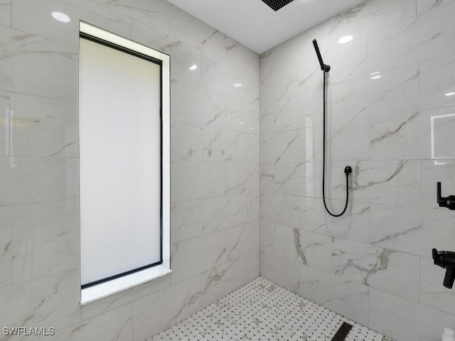bathroom featuring tiled shower