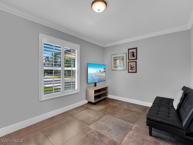 sitting room featuring crown molding and baseboards