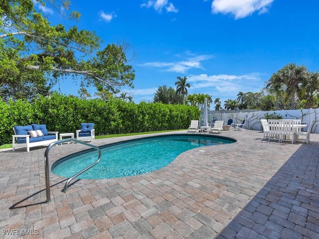 view of pool featuring a fenced in pool and a patio