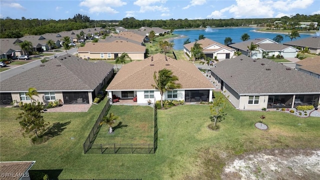 aerial perspective of suburban area with a nearby body of water