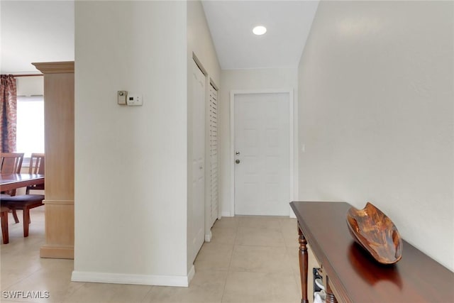 3207 Horse Carriage Way Unit 406, Naples, FL 34105 - hallway featuring baseboards, light tile patterned floors, and recessed lighting