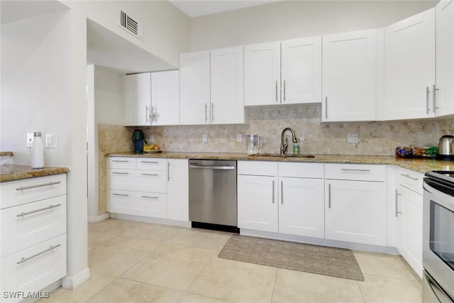 3207 Horse Carriage Way Unit 406, Naples, FL 34105 - kitchen with stainless steel appliances, tasteful backsplash, light stone countertops, and a sink